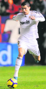 Real Madrid's Cristiano Ronaldo runs with the ball during their match against Osasuna at Reyno de Navarra stadium in Pamplona, on Sunday.