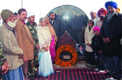 Health Minister Laxmi Kanta Chawla and Animal Husbandry Minister Gulzar Singh Ranike pay tributes to martyrs of the Operation Parakram at Mahwa village.