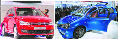 Volkswagen Polo; and (right) Toyotas concept car Etios on display at the 10th Auto Expo in New Delhi on Tuesday.
