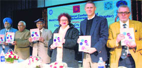 DS Bedi, Savtanter Singh, Licyana, Anthani Corner and Victor Makarot release a book at the 5th International Council for Psychotherapy at Shivalik Public School in Mohali on Tuesday.