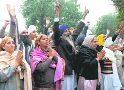 Followers gather in front of the courts complex in Chandigarh on Tuesday.