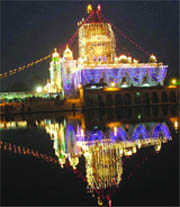 Bangla Sahib Gurdwara is illuminated on the occasion of Prakash Utsav,  in New Delhi on Tuesday.