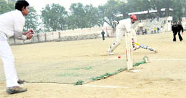 A match in progress at the District Cricket League in Dehradun on Tuesday.