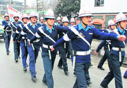 Traffic cops take out a parade as part of the ongoing traffic safety week in Srinagar.