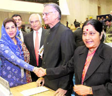 Leader of Opposition in Lok Sabha Sushma Swaraj shakes hand with Speaker of Pakistan National Assembly Fehmida Mirza (L) as former Home Minister Shivraj Patil looks on during the 20th Conference of Speakers and Presiding Officers of the Commonwealth in New Delhi on Tuesday.