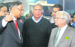 Tata Motors chairman Ratan Tata (centre) with Ashok Leyland MD R. Seshasayee (left) and Tata Motors vice-chairman Ravi Kant at the 10th Auto Expo in New Delhi on Wednesday. 