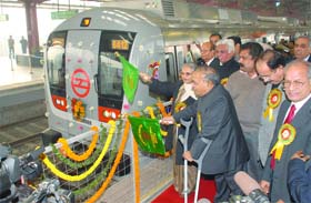 Delhi minister for finance, planning and power Ashok Kumar Walia with union minister for urban development Jaipal Reddy, Delhi Chief Minister Sheila Dikshit and DMRC chairman E. Sreedharan flag off a Metro train on the Yamuna Bank-Anand Vihar line in New Delhi