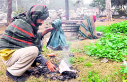 Ashwini Kumar, a man, dries his pair of jeans in Ludhiana on Wednesday