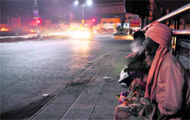 A few spend night on a roadside to keep the cold at bay in Ludhiana on Wednesday