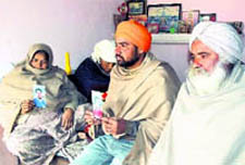 Members of the family of Ranjot Singh at their house in Alhora village in Nabha
