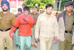 The murder accused being produced at the district courts in Sector 17, Chandigarh, on Thursday.