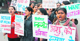 Students of the National Institute of Nursing Education raise slogans at the PGI in Chandigarh on Thursday.