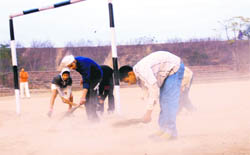 Budding football players of Dadu Majra village prepare the ground for the forthcoming seven-a-side football tournament at Dronacharya Stadium in Chandigarh on Thursday.