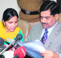 Home Secretary Ram Niwas reads out the probe report at Chandigarh on Thursday.