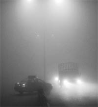 A car takes a wrong turn in dense fog on the Chandigarh-Ambala highway.