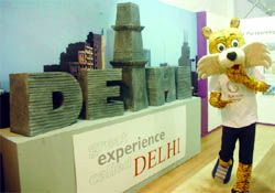 Commonwealth Games mascot Shera stands beside an exhibit at Vigyan Bhawan during the ongoing Pravasi Bharatiya Divas in New Delhi on Thursday.