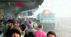 Heavy fog engulfs the Faridabad railway station on Thursday morning.