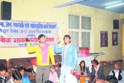 Participants perform during a workshop on Folk music in Panchkula.