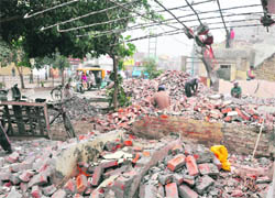 Debris of demolished structures in Jawahar Nagar Camp.