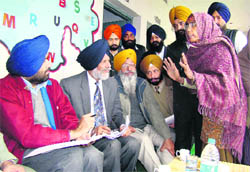 Chairman of the District Planning Committee, Patiala, Surjit Singh Rakhralistens to the grievances of residents during a Sangat Darshanprogramme in Patiala on Wednesday. 