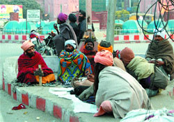 Destitutes and beggars on the pavements near Hall Bazaar in Amritsar.
