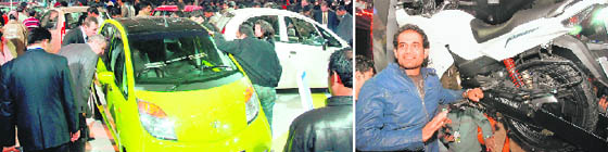 (Top) Rush of visitors at TATA stall and cricketer Irfan Pathan at Hero Honda stall at the ongoing Auto Expo 2010 in New Delhi on Friday. 