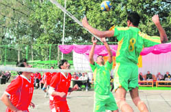 Players in action during the final of the North Zone Accountant General Volleyball Tournament in Chandigarh on Friday.