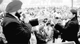 Congress MLA Balbir Singh Sidhu and president of Rasenheri-Swara Dumping Ground Roko Sangarsh, Paramjit Kaur, argue during a public hearing session on the setting up a common municipal solid waste management facility at Jhanjehri village on Friday.