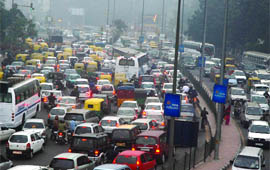 Commuters caught in a traffic snarl at Rajpath in New Delhi on Friday.