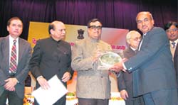 Ajay Maakan, Union Minister of State for Home Affairs, presents awards to the winners in Dehradun
