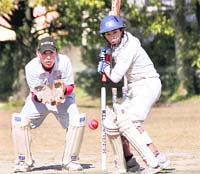 Batsman defends a delivery in a match at the 58th District Cricket League in Dehradun