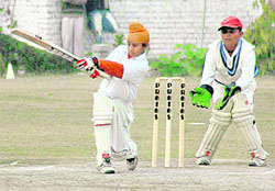 A batsman of Saupins Fighters plays a shot during a semifinal match against GNPS & CCA-36 in Chandigarhon Saturday.