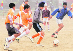 A match in progress during the two-day Second Football Cup, organised by the Guru Gobind Sports Club, at Guru Dronacharya Sports Stadium, Dadu Majra village, Chandigarh, on Saturday. 