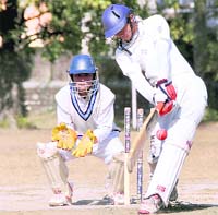 A batsman faces a delivery during a
