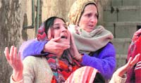 Relatives wail over the death of a youth in Jammu 