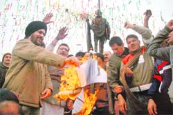Members of the Refugees Sangharsh Morcha burn copies of the Working Groups report in Jammu