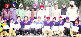 Hockey players of Government Senior Secondary School, Amloh, with their certificates.