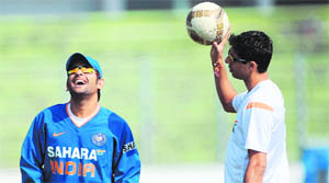 Indian captain Mahendra Singh Dhoni (L) and Ashish Nehra during a practice session at The Sher-e Bangla National Stadium in Dhaka on Saturday.