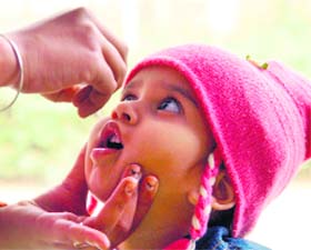 A child being administered pulse polio drops at AP Jain Hospital in Rajpura