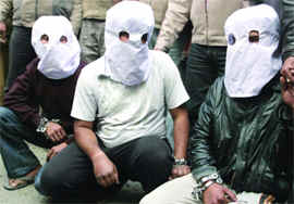 The three persons being presented before the media in New Delhi on Sunday.
