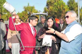The Union Minister understands the working of an INSAT-linked micro met tower at the FRI