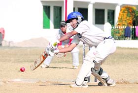 A batsman plays a shot at the u-17 District Cricket League in Dehradun