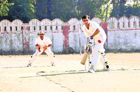 A batsman faces a delivery at the 58th District Cricket League in Dehradun