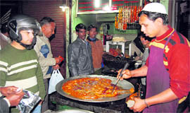 Visitors flock to Rajdhani Chicken Point at Innahmullah Building in Dehradun.