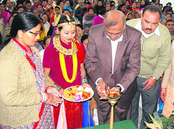 Dr Rakesh Kumar Jain lights a lamp at the founders day ceremony of the Purva Sainik Welfare Association at Garhi Cantt in Dehradun on Sunday.