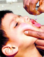  A child being administered drops in Srinagar on Sunday.