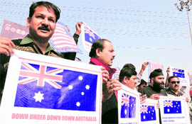 Protesters hold placards during a demonstration against the Australian government for failing to prevent attacks on Indians, in Ranchi on Sunday.