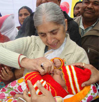 Health Minister Laxmi Kanta Chawla (above) administering polio drops to a child during a state-level function organised to launch the pulse polio campaign at the Civil Hospital in Ferozepur on Sunday;