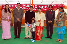 A tiny-tot being given prize during a baby show organised at the Doon Public School, Kararwala, Bathinda on Saturday