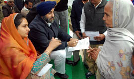 Bathinda MP Harsimrat Badal and Deputy Chief Minister Sukhbir Badal at Maur Mandi in Bathinda district on Monday.